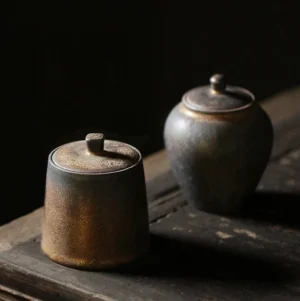 full collection view of two vintage antique bronze ceramic Chinese tea canisters