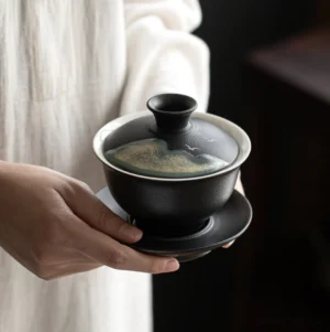 Black ceramic gaiwan with traditional Chinese landscape painting full set view