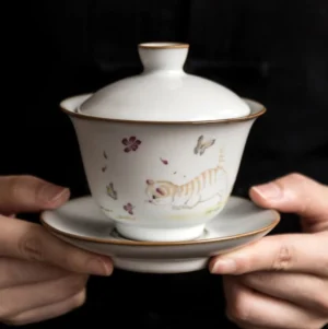full front view of hand-painted cute cat ceramic gaiwan with gold trim