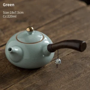 Green crackle glaze side handle teapot with wooden handle and blue white ceramic pendant