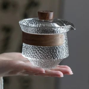 full view of hammered glass gaiwan teapot set with wooden handle on matching wood tray