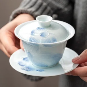 Full three-piece view of hand-painted blue lotus ceramic gaiwan