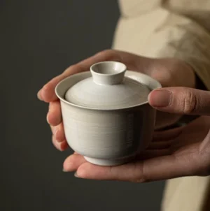 Handcrafted 4oz off-white ceramic gaiwan with natural spiral texture full product view