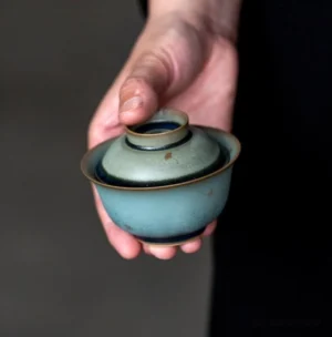 front view of handcrafted teal mini gaiwan with gold accents for gongfu tea