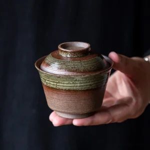 Full view of handmade vintage brown clay gaiwan with green glaze band