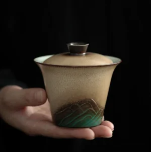 Hand-painted ink mountain ceramic gaiwan tea set with matching storage canister product display