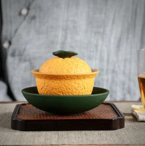 Handcrafted orange bionic ceramic gaiwan with green saucer full product view