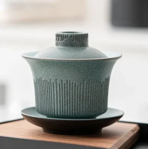 Full view of handcrafted textured 5oz ceramic gaiwan with sage green exterior