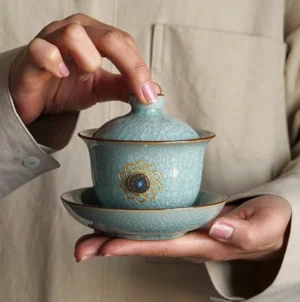 Zen 5.4oz ice crack ceramic gaiwan with blue body and golden lotus decoration